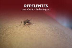 Mosquito Aedes Aegypti, conhecido popularmente como mosquito da dengue, no braço de uma pessoa. Junto há uma frase que diz; repelentes para o mosquito da dengue.